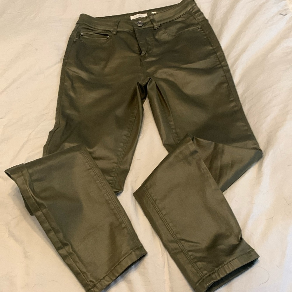 Looks like shiny leather army green pants, high waisted skinny.